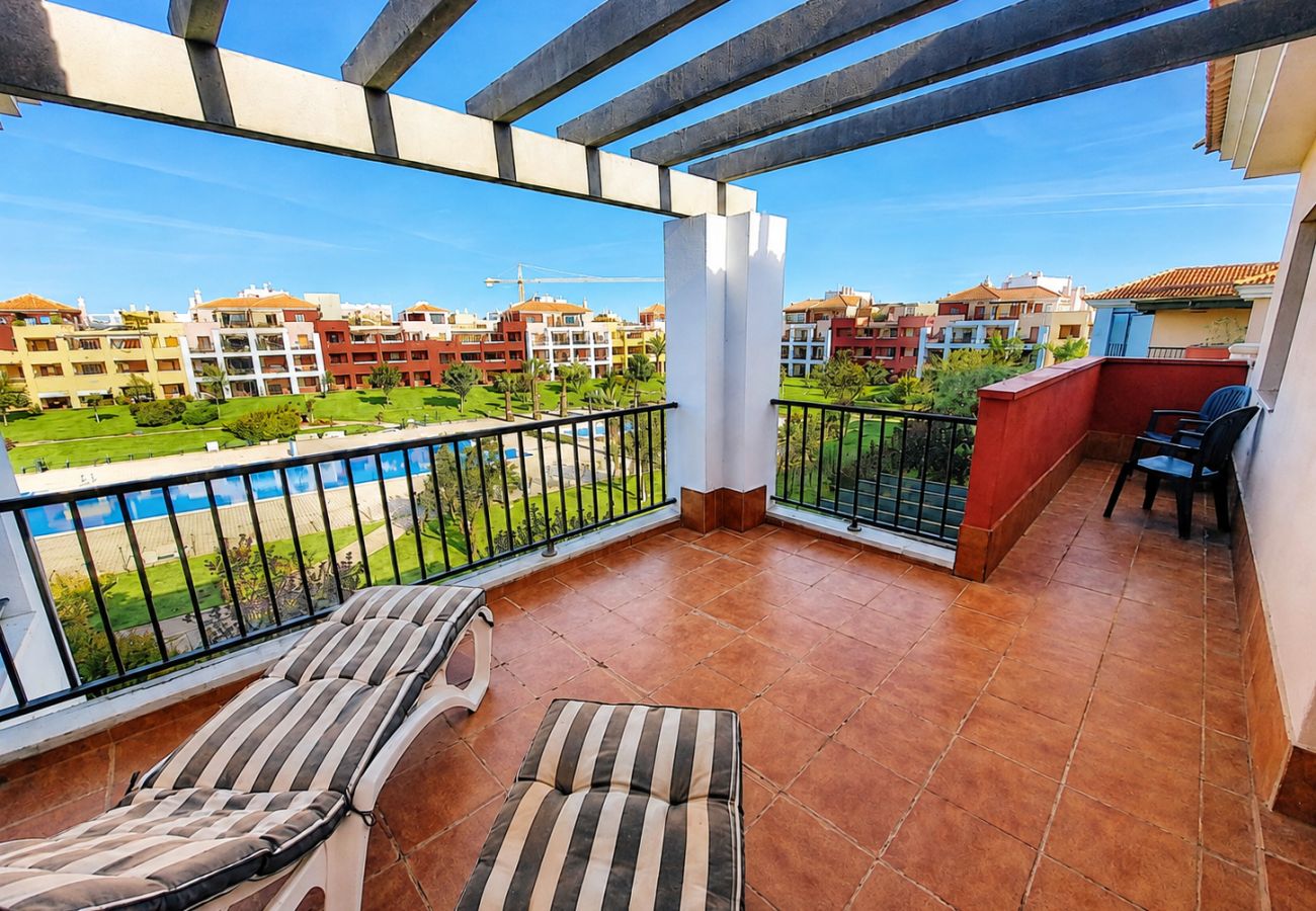 Apartamento en Isla Canela - Rincón del Gol III, Ático con vistas a la piscina y jardines